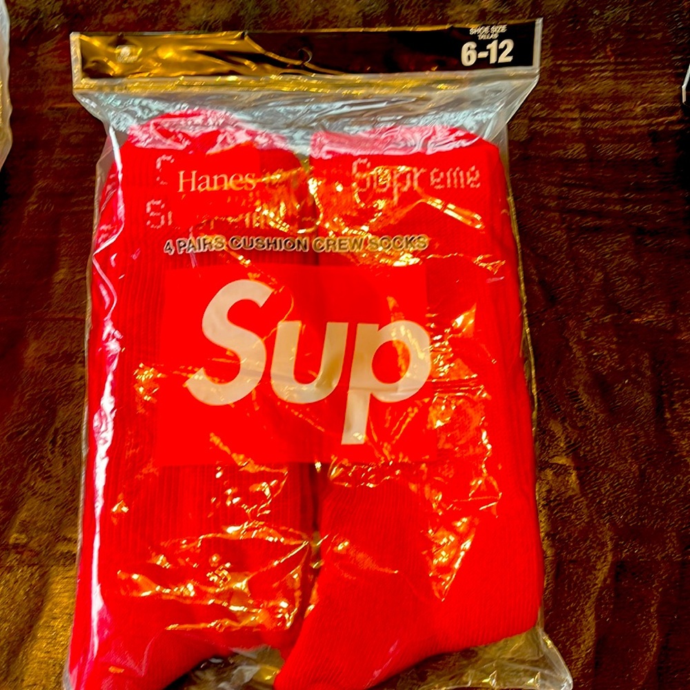 Supreme logo, Hanes pack of four socks, fits size 6-11. New and sealed bag.